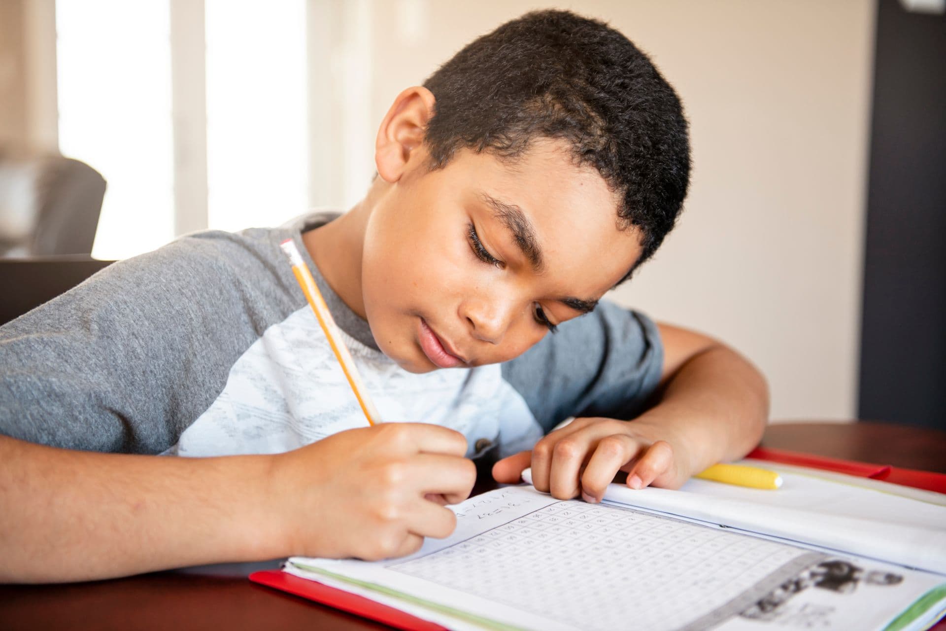A child writing in a notebook